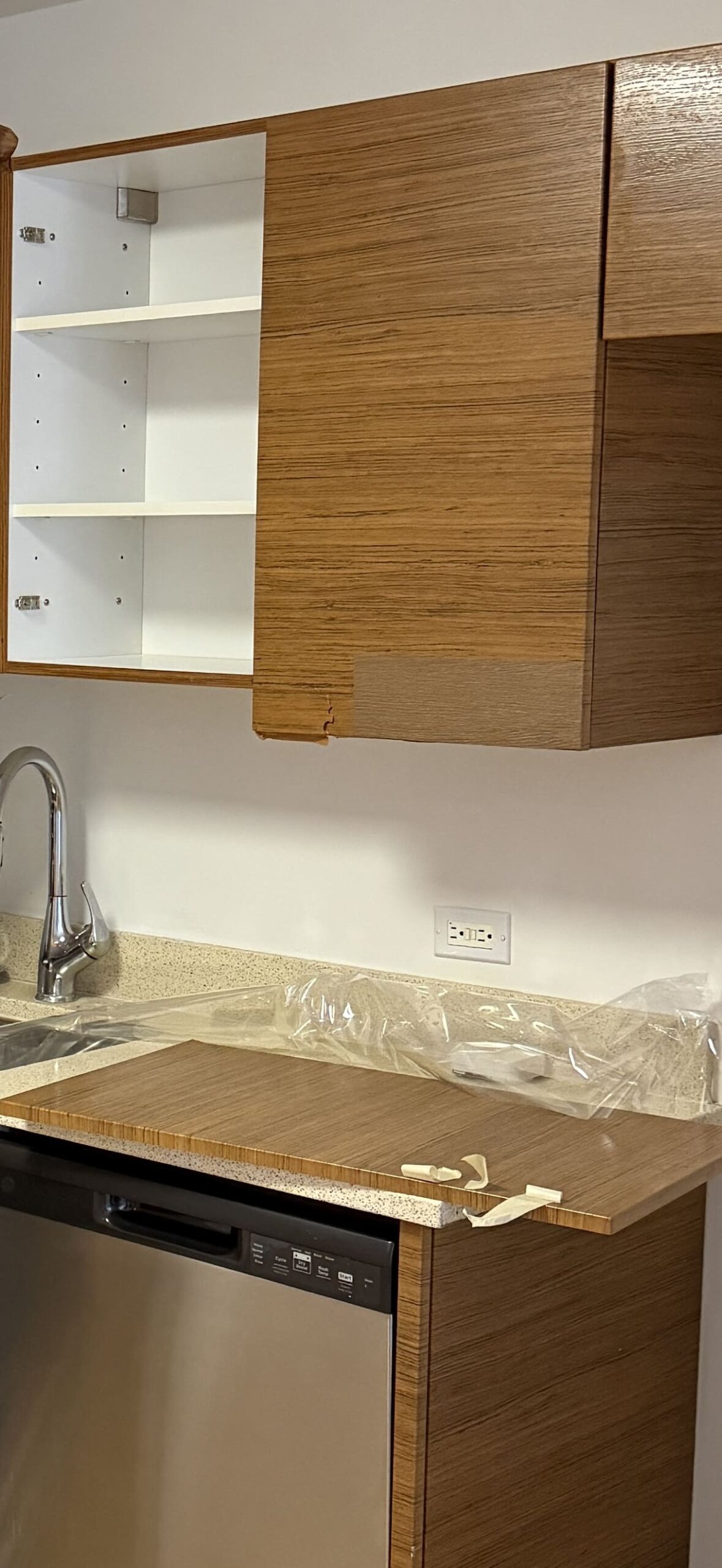 Before kitchen surface refresh showing worn surfaces