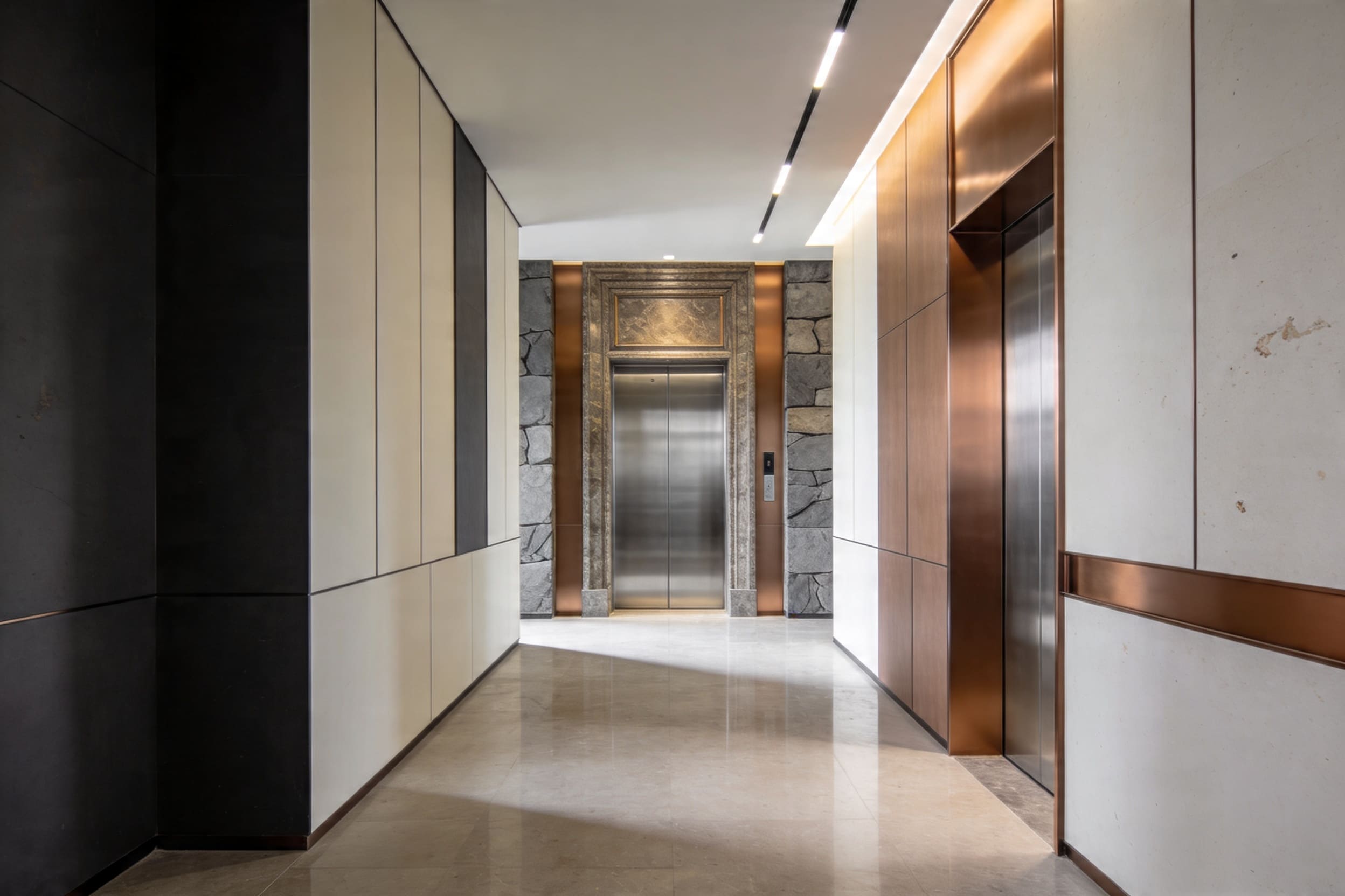 Elevator entrance upgrade in a refined commercial corridor