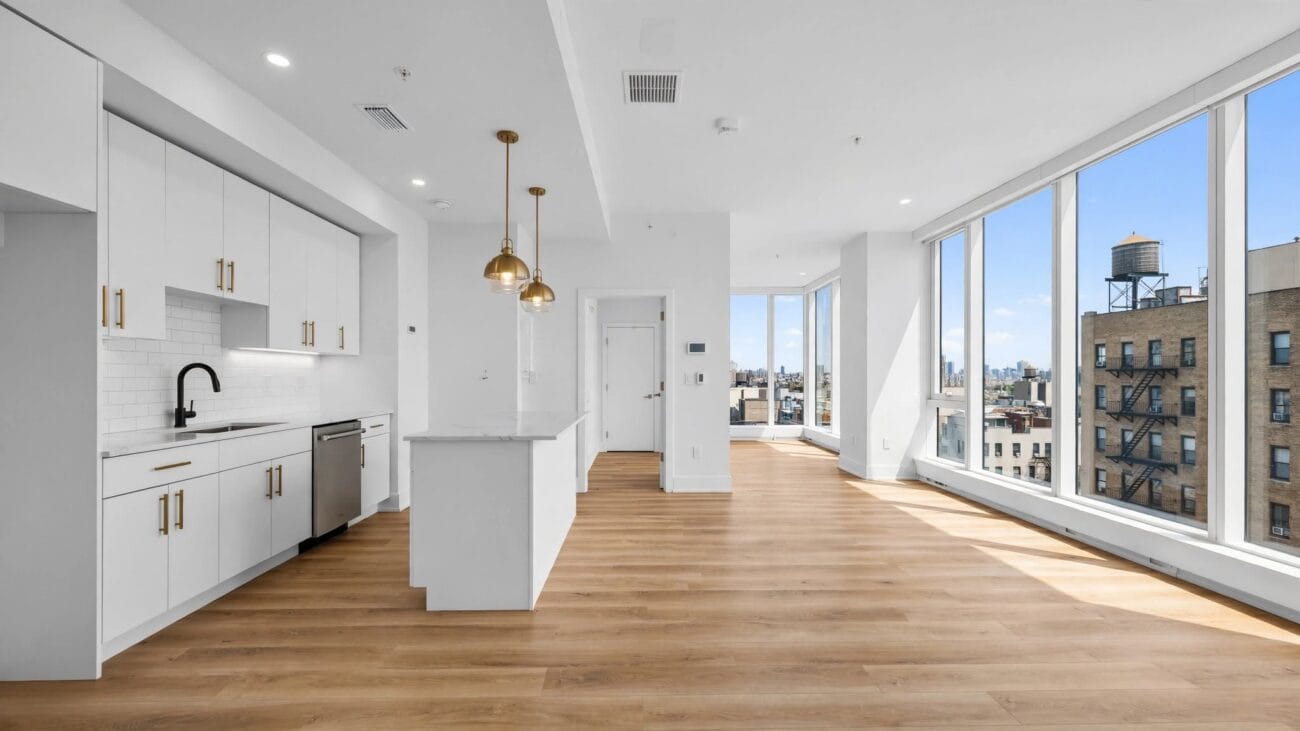 Freshly renovated bright vacant NYC apartment with flawless white walls and new light oak LVP flooring