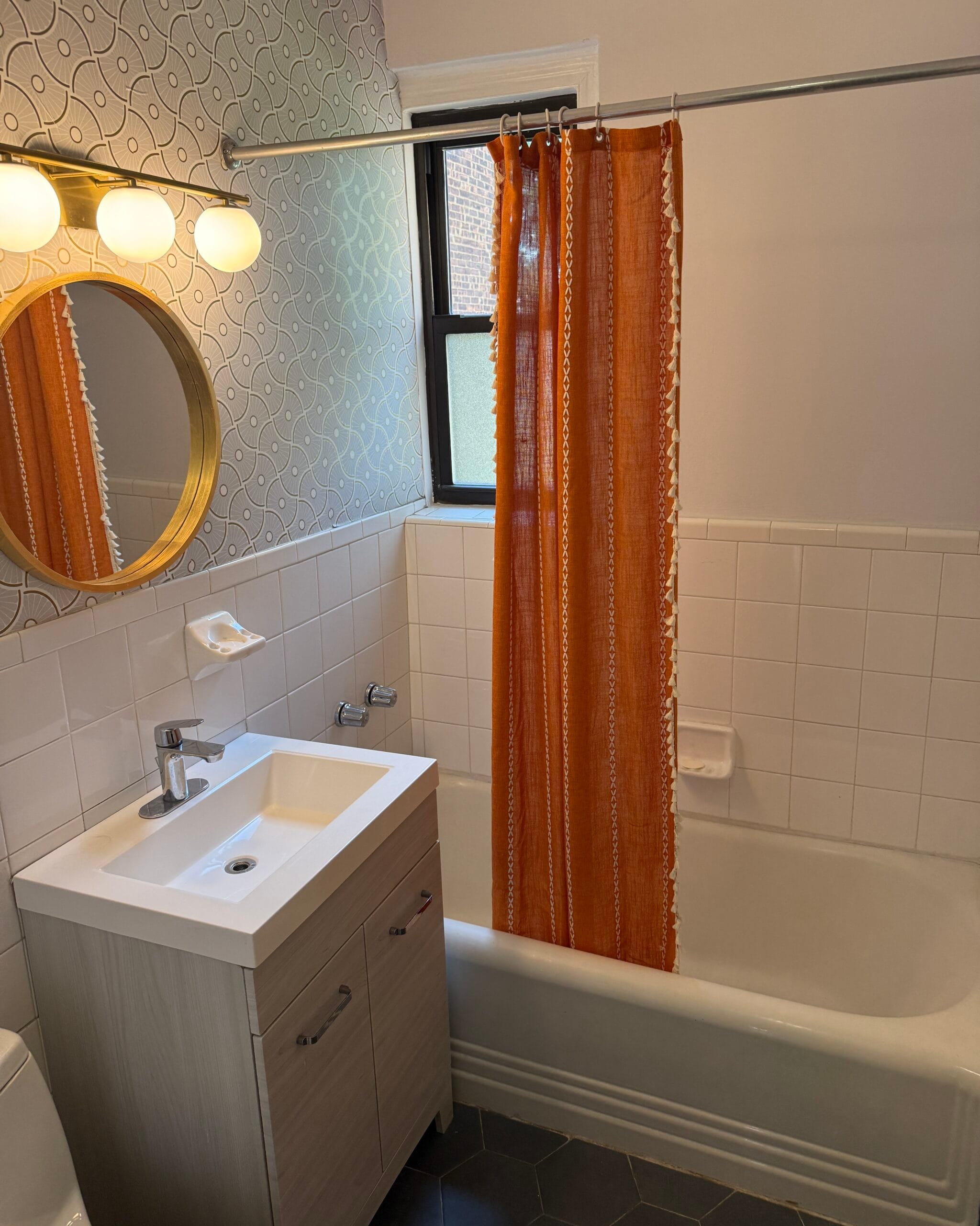 Outdated bathroom before renovation in Forest Hills, NYC